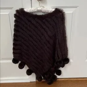 Women’s preowned rabbit poncho.